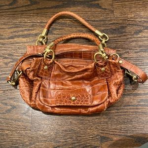 Coach bag, there is some wear and tear. Interior has pen markings